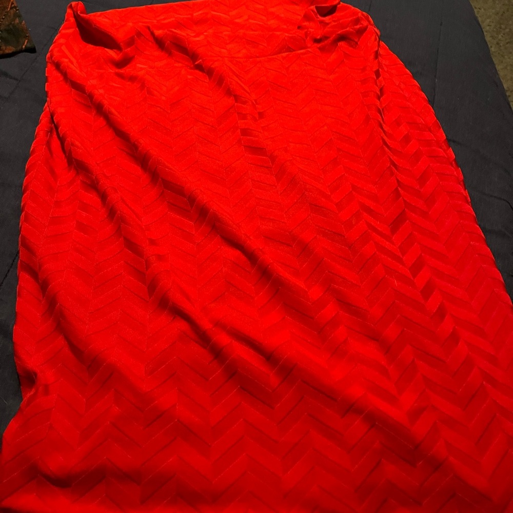 Red Lularoe Skirt XL worn twice . Fitted goes to the knees .